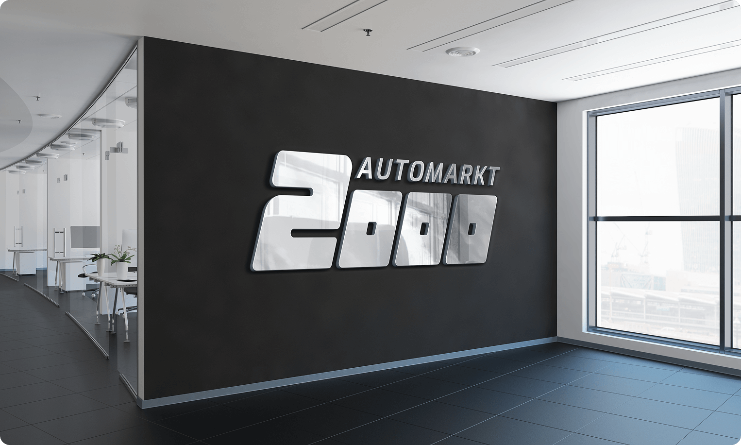 Automarkt 2000 logo redesign showcased as metallic wall signage in office environment